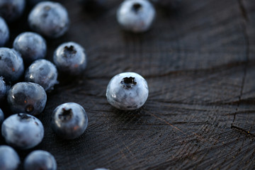 Blueberries on a dark wooden background
