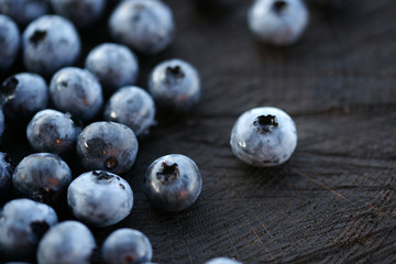 Blueberries on a dark wooden background