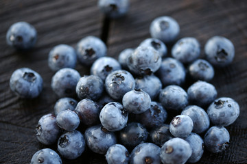 Blueberries on a dark wooden background