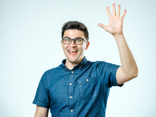 Naklejka premium Young man making high five gesture