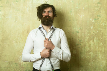 Hipster in shirt and suspenders.