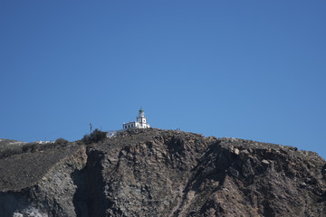 Lighthouse on top of a Cliff
