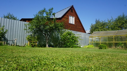 Obraz premium Russia Countryside Cabin and garden