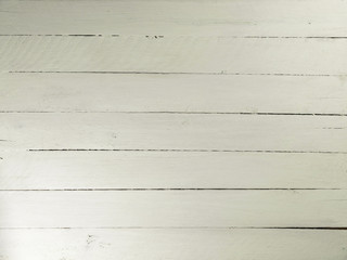 White painted wall with wooden planks.
