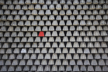 Stacked concrete railway sleepers , Railway sleepers background. with the red one