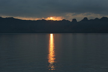 Sunset around the beautiful komodo island inside of national park in indonesia, home of the komodo dragon, unique ecosystem and great adventure, nature habitat, travel and enjoy asia 