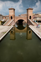 Comacchio, Ferrara, Emilia Romagna, Italy, Europe. The ancient bridge Trepponti, a famous five-way bridge in the old town known as the Little Venice