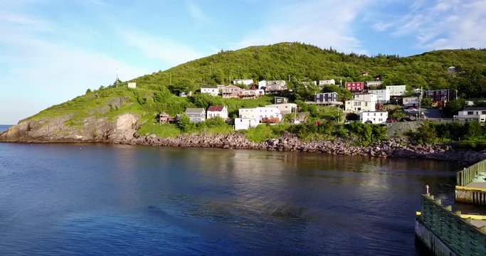 Beautiful Petty Harbour with two piers during summer sunset, Newfoundland, Canada