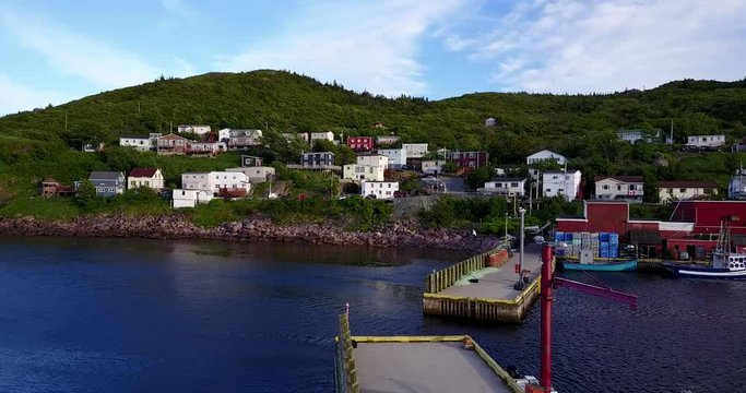 Beautiful Petty Harbour with two piers during summer sunset, Newfoundland, Canada