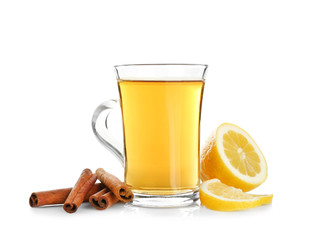 Cup of aromatic hot tea with cinnamon and lemon on white background