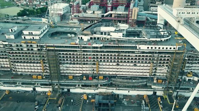 Aerial view of a big cruise ship under construction at the shipyard