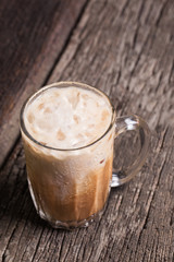 Thai iced tea signature local beverage on wooden background