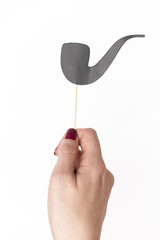female hand holding smoking pipe photo booth prop