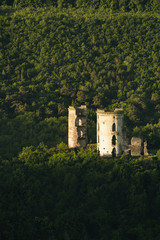 Fototapeta na wymiar ruin of the old castle in the hilly valleys, travel, historical values