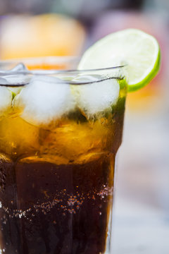 Cola drink with ice and lime