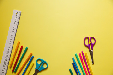 back to school styled pattern with school supplies on yellow background