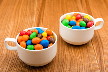 Colored sweets in chocolate