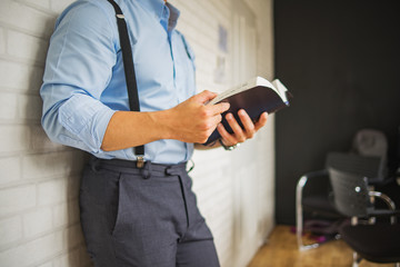 Man reading. Book in his hands.