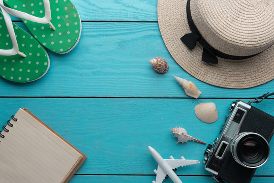 Summer holiday background, Travel and vacation items on wooden table. Top view