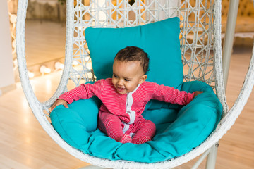 Portrait of mixed race kid at home