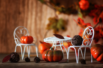 fresh pumpkin in interior wooden room on chair