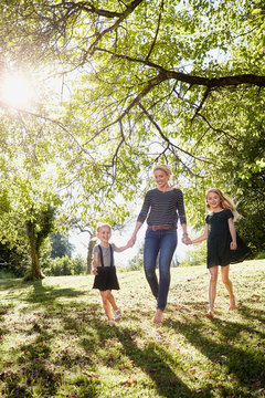 Mother and daughters enjoying park