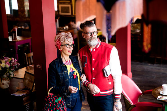 Quirky couple relaxing in bar and restaurant, Bournemouth, England
