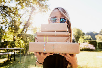 Girl carrying brown paper packages