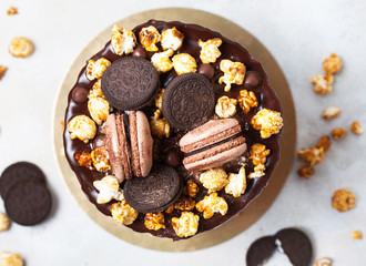 Party cake with macaroons and Popcorn, birthday concept. Top view, flat lay
