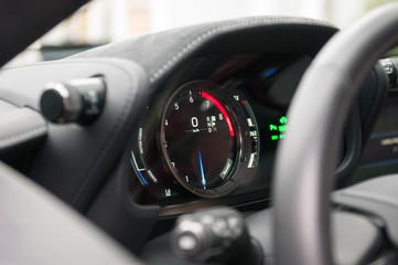 Obraz premium Tachometer and speedometer in the new sports car.