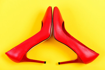 Pair of elegant female shoes in red colour, top view