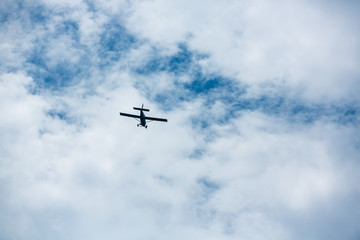 airplane flying in cloudy sky, Bottom view angle of air plane flying in the sky, Retro style airplane