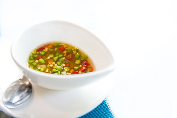 Fish sauce with chilli in white cup,concept of spicy
