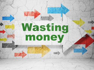 Banking concept: arrow with Wasting Money on grunge wall background