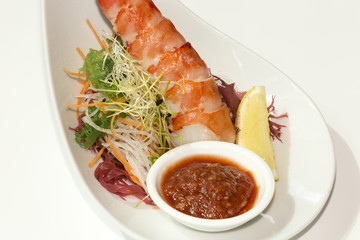 Shrimp cocktail with sauce and lemon