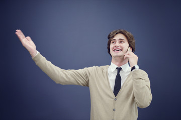 young casual man talking on the phone isolated on white background