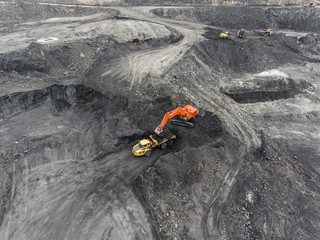 Aerial view open pit mine, loading of rock, mining coal, extractive industry