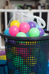 Colorful toy balls in mesh bag