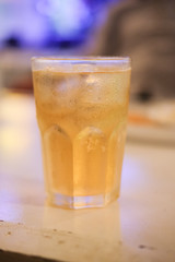 Glass of beer on the table in pub