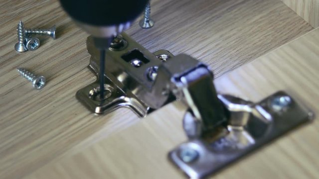 the process of furniture assembly screws closeup
