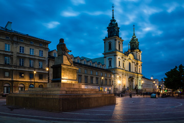 Fototapeta na wymiar Church of the Holy Cross at night in Warsaw, Poland