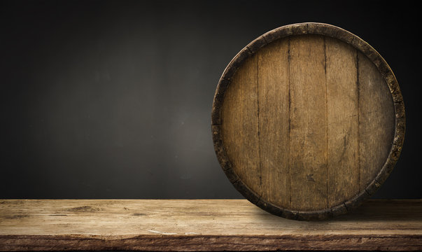 background of barrel and worn old table of wood.