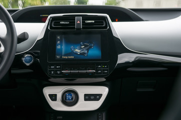 Hybrid car interior with infotainment system.