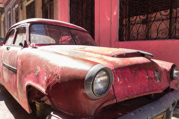 Pink cuban car in streets of havana