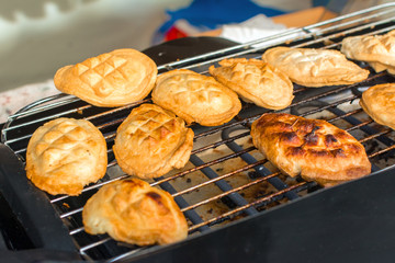 Traditional Polish smoked cheese made of sheep milk known as oscypek on barbecue. 