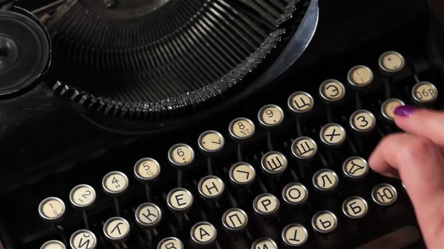 Typist typing on an old typewriterr
