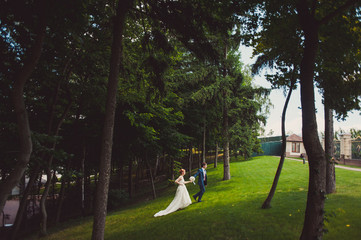 Beautiful bride and groom couple walking at the wedding
