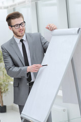 Fototapeta premium businessman pointing pen on blank Board for presentation