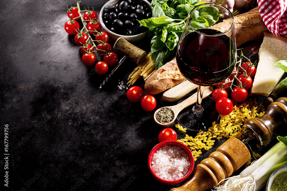 Poster tasty fresh appetizing italian food ingredients on dark background.