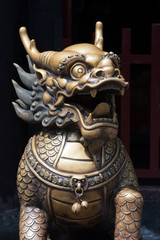 Obraz premium Bronze dragon head sculture at the entrance of a buddhist temple, Chengdu, China